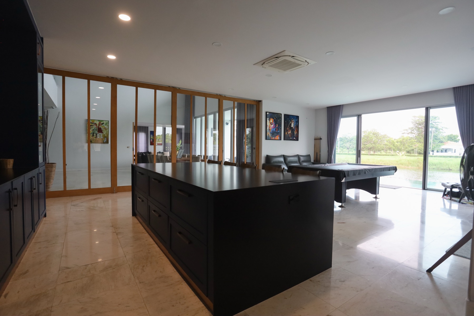 Bar and games room with a granite island and lake views